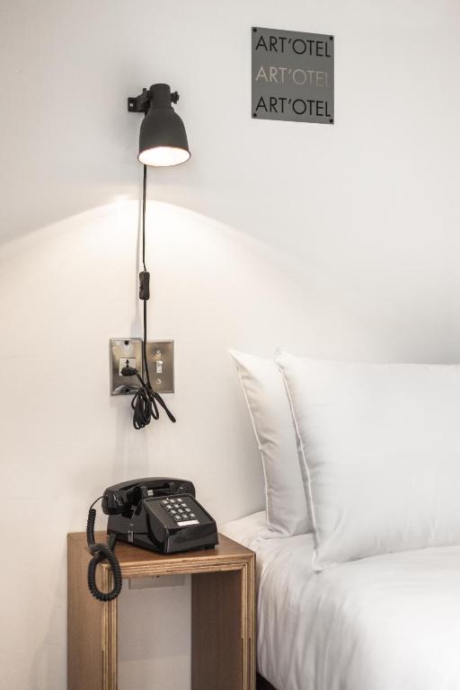 Postel nebo postele na pokoji v ubytování ART'OTEL Ximending TAIPEI