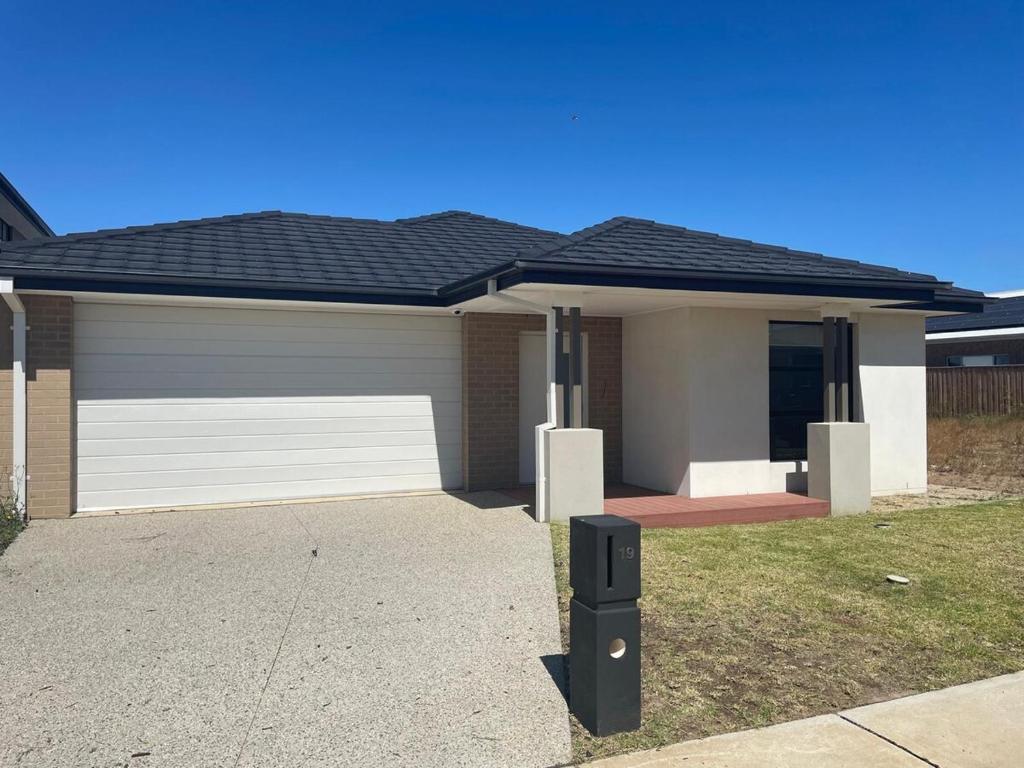 a house with a garage with a roof at Southern Retreat in Clyde North