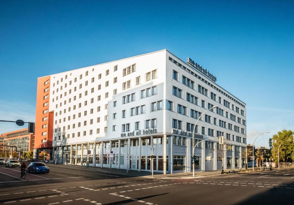 a white building on the corner of a street at Me and All Hotel Berlin East Side, by Hyatt in Berlin