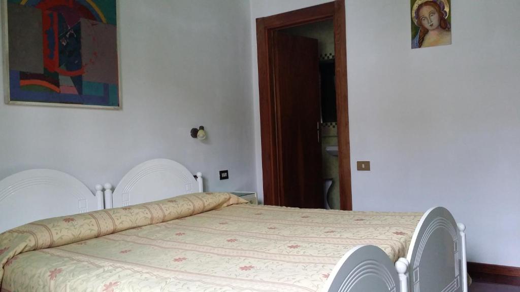 Postel nebo postele na pokoji v ubytování B&B Francesco in Assisi