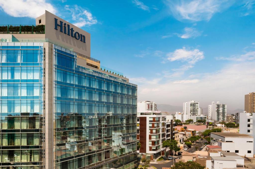 a building with a hilton sign on top of it at Hilton Lima Miraflores in Lima