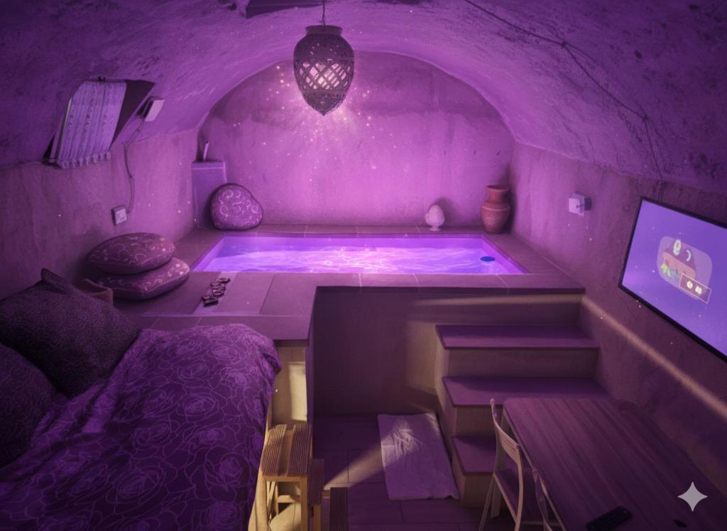 a purple room with a tub with a bed and a table at Il Casale dei Principi in Lecce