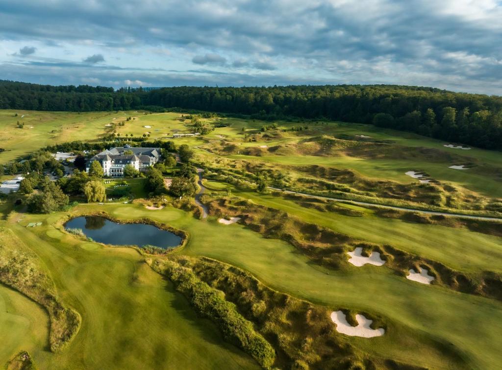 an aerial view of a golf course at Hotel Hofgut Georgenthal in Burg Hohenstein