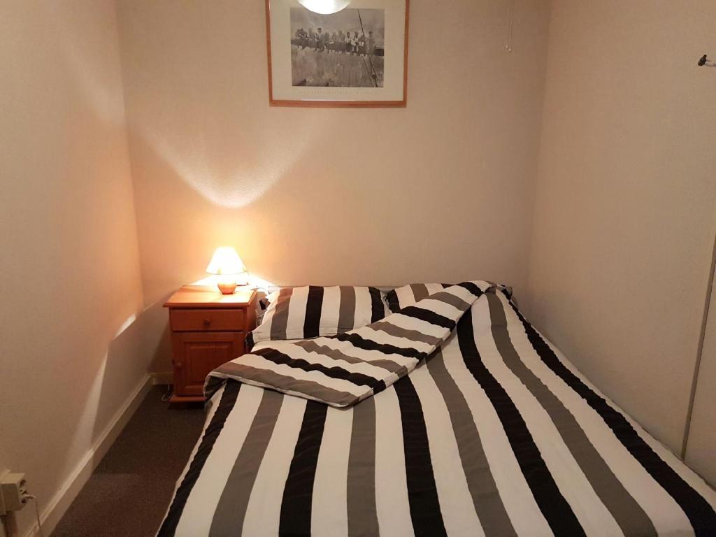 Ένα ή περισσότερα κρεβάτια σε δωμάτιο στο Vino Grando Cottage