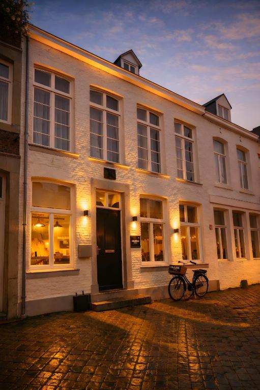 a building with two bikes parked in front of it at Hotel Trash Deluxe in Maastricht