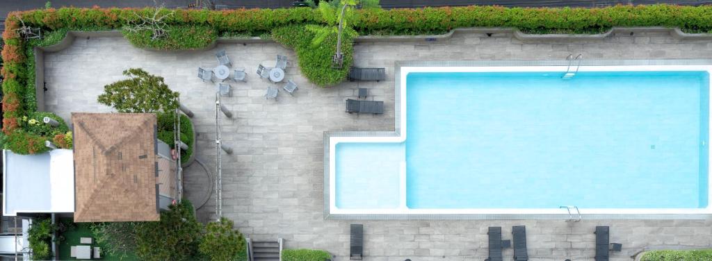 a swimming pool on the side of a building at BU Place Hotel in Bangkok