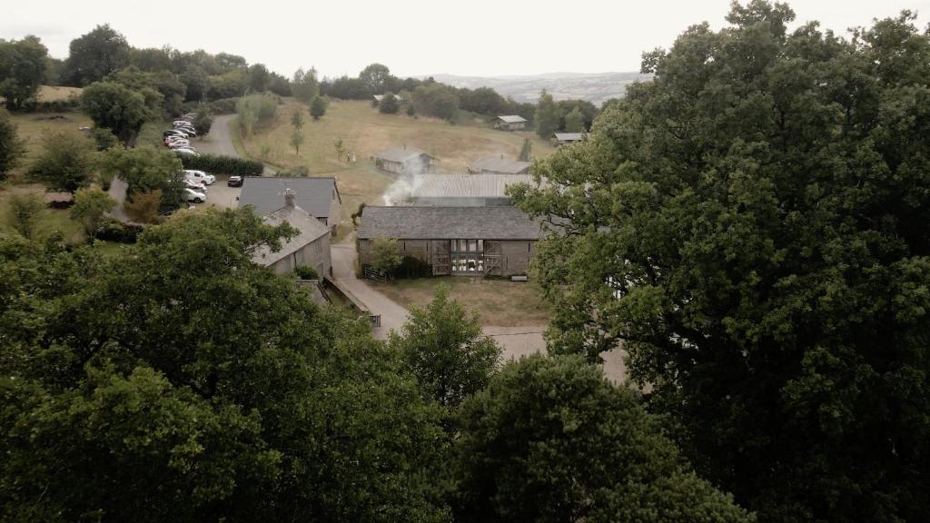an aerial view of a house with trees at Drovers Rest Farm Stay in Hay-on-Wye