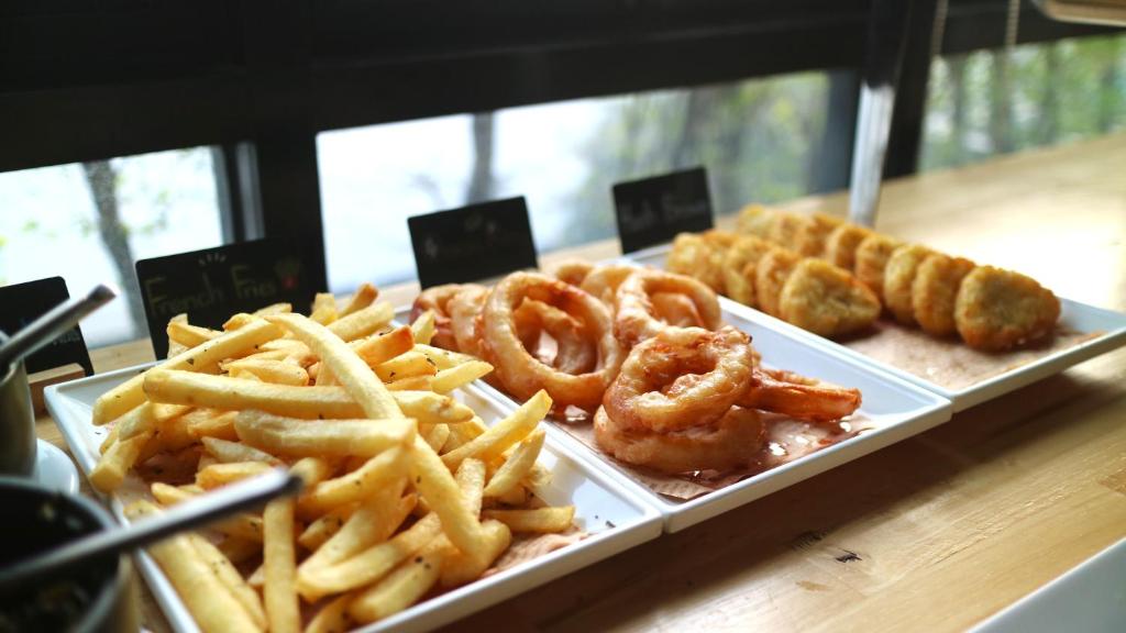 A buffet station offering fries, fried rings and breaded items.