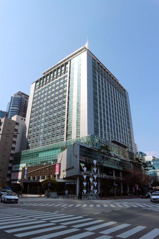 a large building in a city with a street at W Residence Hotel Centum City in Busan