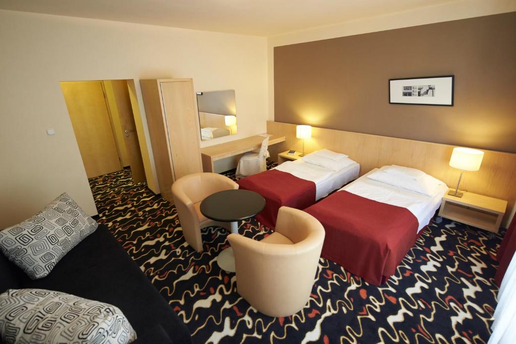 Postel nebo postele na pokoji v ubytování Hotel Laterum