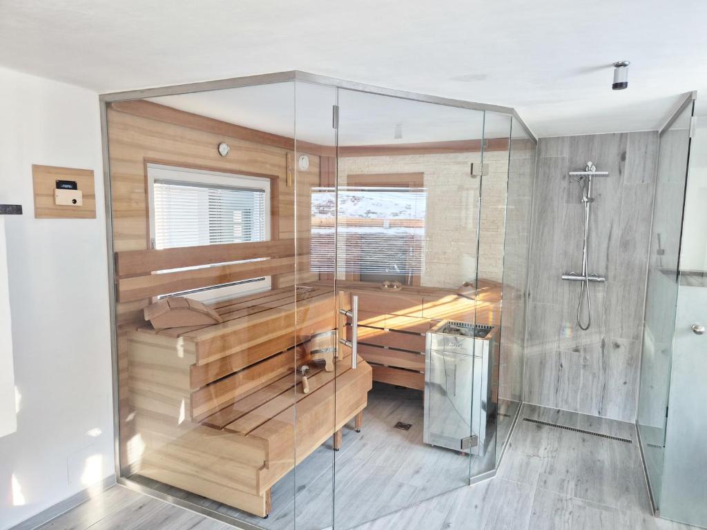 a bathroom with a tub and a shower at Kreischberg Deluxe with Finnish Sauna in Sankt Lorenzen ob Murau