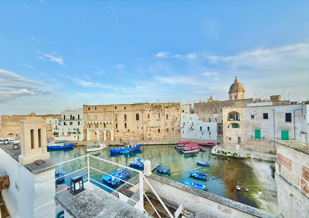 a view of a city with boats in the water at Residenza Garibaldi in Monopoli