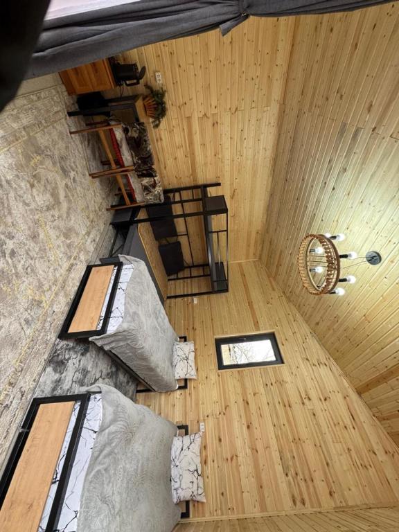 an overhead view of a room with pillows on the floor at Han Karakol in Karakol