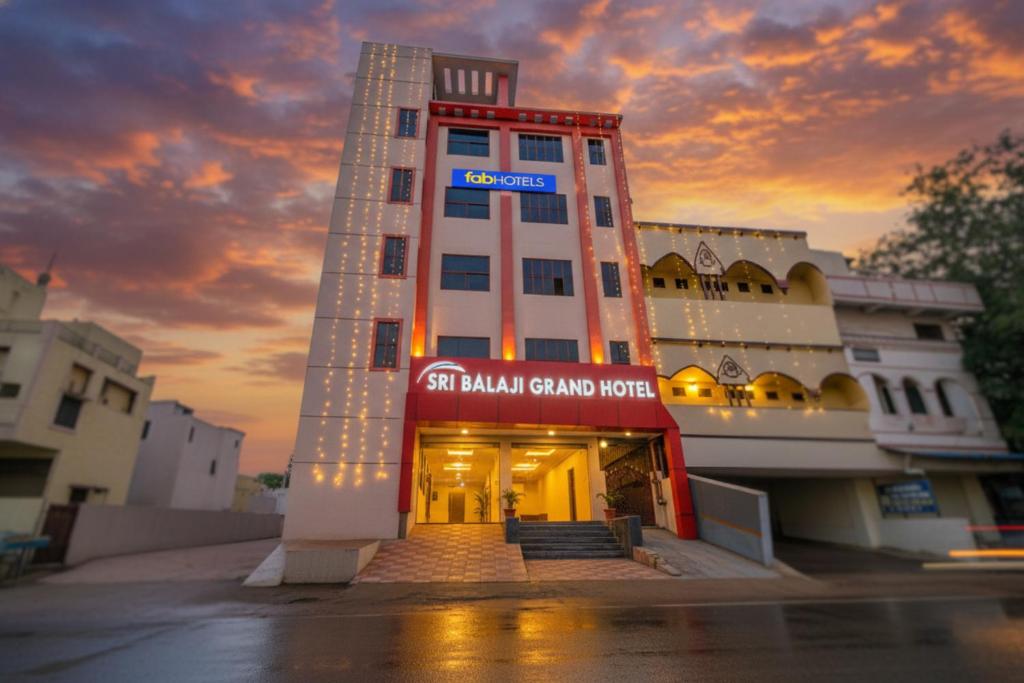 a building with a sign on the front of it at FabHotel Sri Balaji Grand in Hyderabad