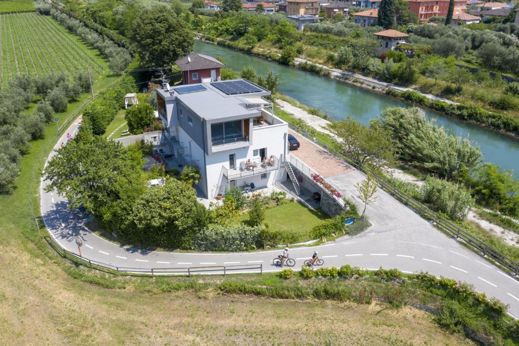 an aerial view of a house next to a river at Appartamenti Villa al Fiume in Nago-Torbole