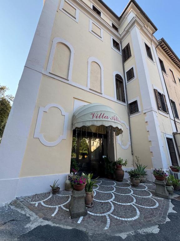 a building with a sign on the front of it at Villa Altieri in Albano Laziale