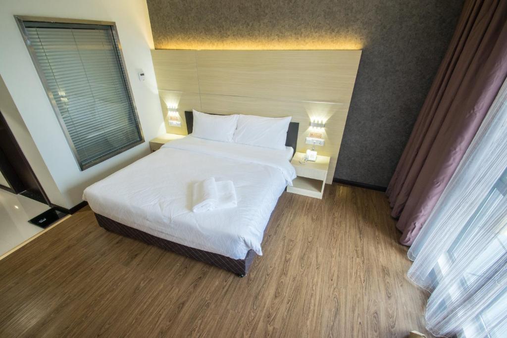 Postel nebo postele na pokoji v ubytování Hotel Labuan Point