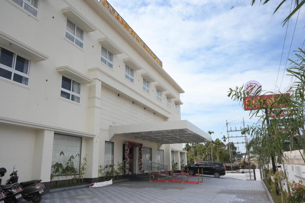 a view of the front of a hotel at Celestial International in Taliparamba