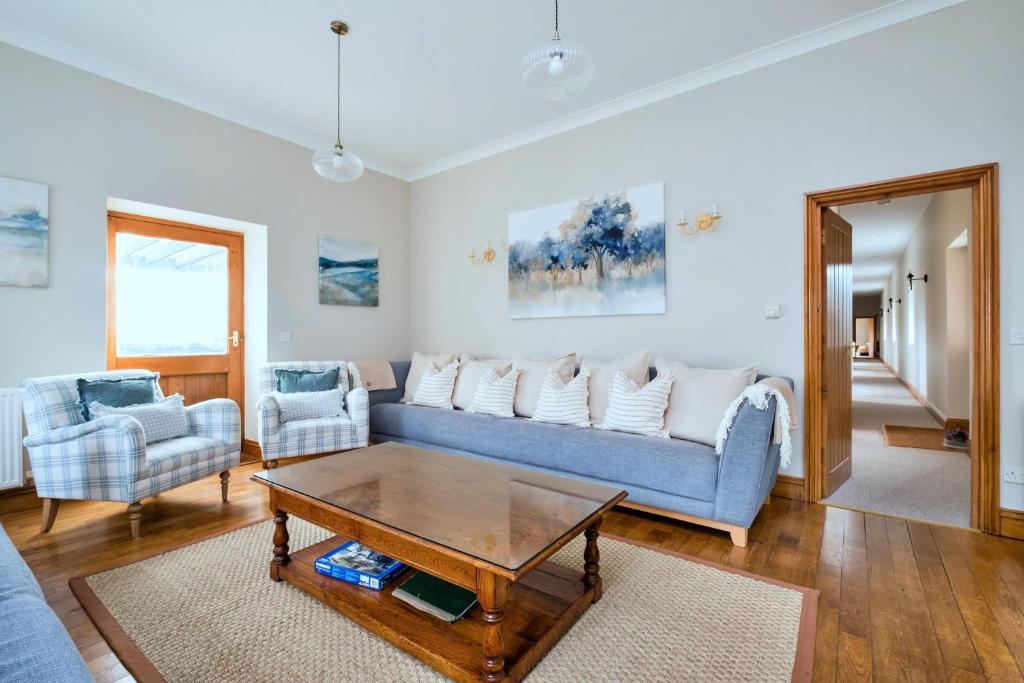a living room with a couch and a coffee table at Finest Retreats - The Park in Onibury