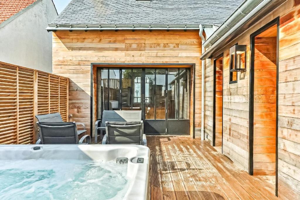 a hot tub in the backyard of a house at Welcome to Villa Floréal Your tranquil retreat with spa in Saint-Gilles-Croix-de-Vie