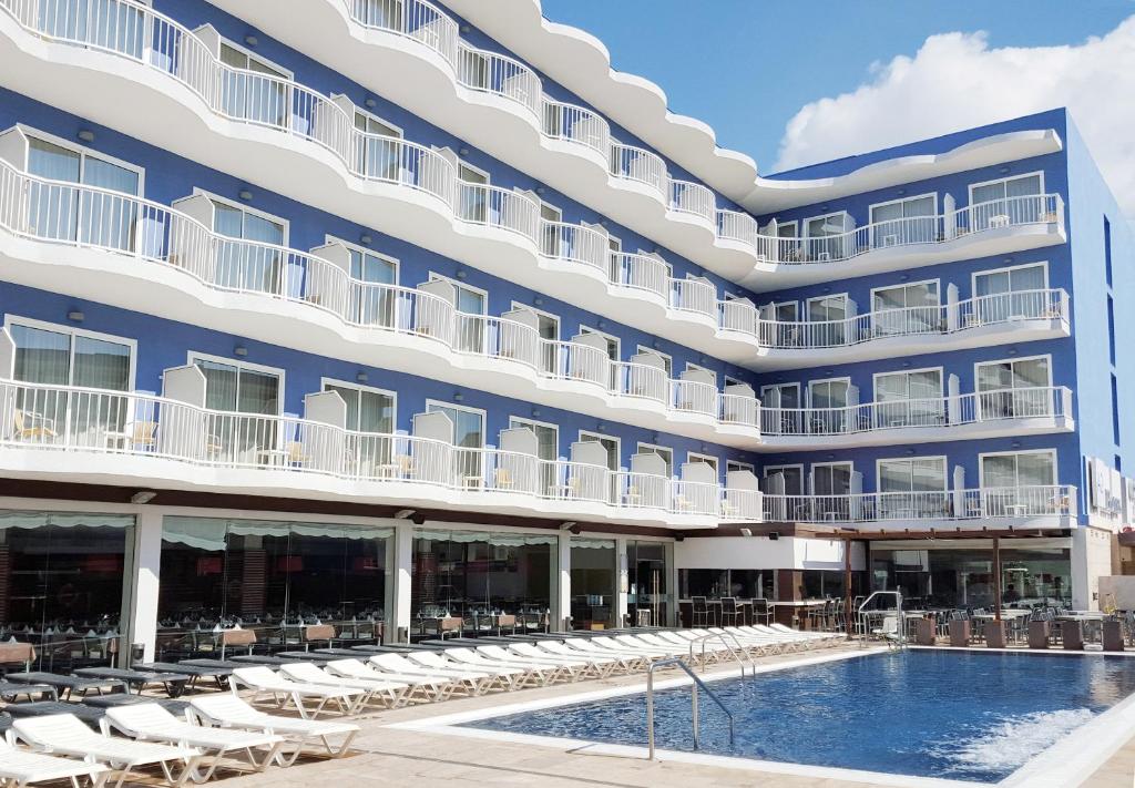 an exterior view of a hotel with a swimming pool at Cesar Augustus in Cambrils