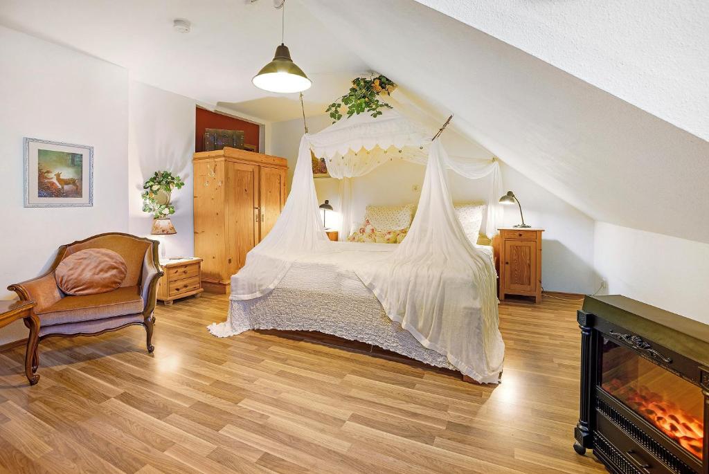 a bedroom with a bed with a mosquito net at Comic Fantasy in Lindau