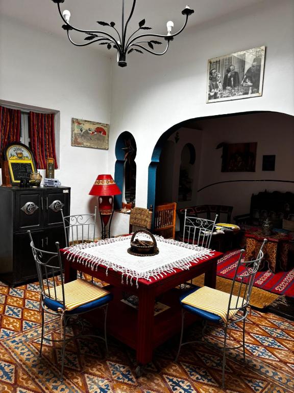 a dining room with a table and chairs at 34 Degrés Sud in Mirleft