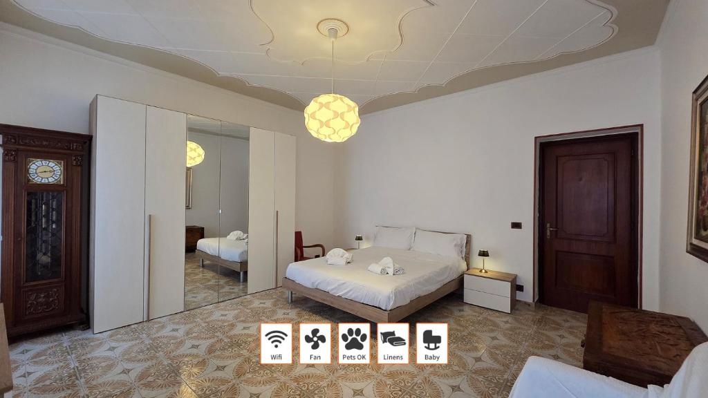 a bedroom with a bed and a mirror at Poesia - By Ligooria in Pietra Ligure