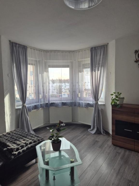 a living room with a couch and a table at Inna's and Dima's Ferienwohnung in Pirmasens