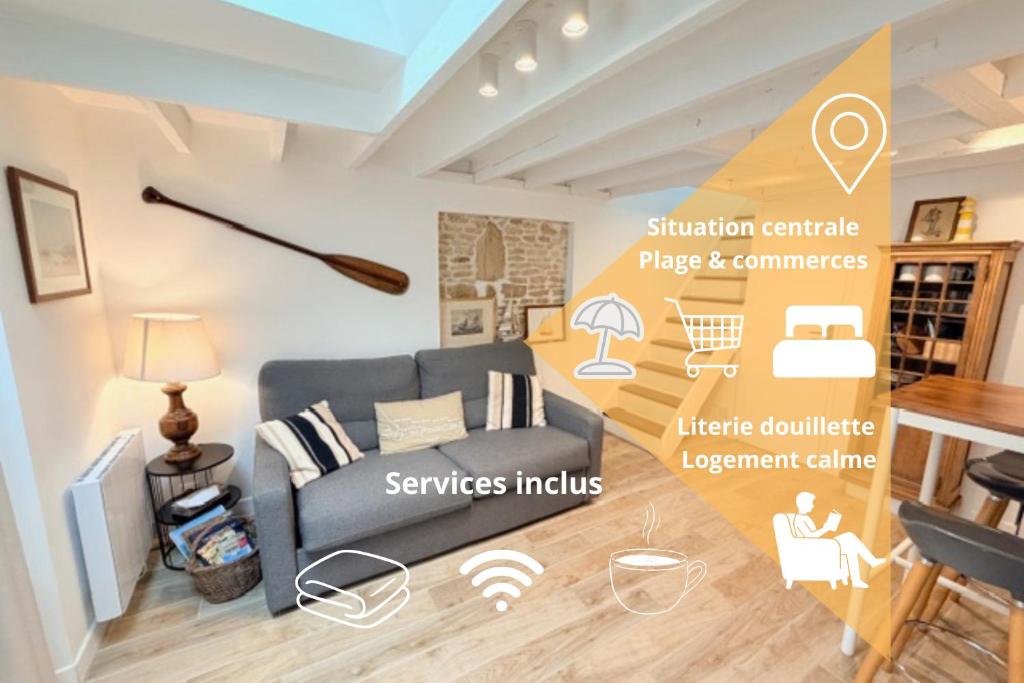 a living room with a couch and a table at La Coquille Séjour en Duo Confort Maisonnette de bourg à Ouistreham - Situation idéale commerces & plage - Wifi et linge inclus in Ouistreham