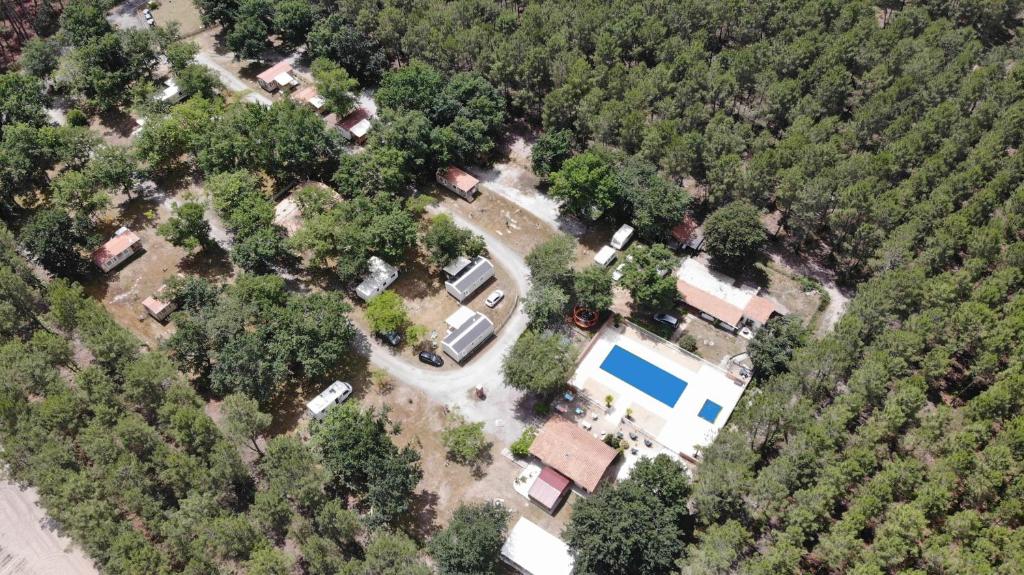 an aerial view of a house with a yard and trees at Camping le Laha in Lesperon