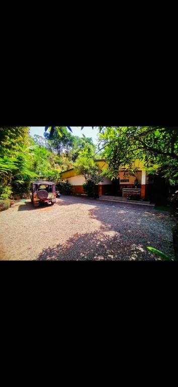 a van parked on the side of a road at Munnar Plantation Villa in Munnar