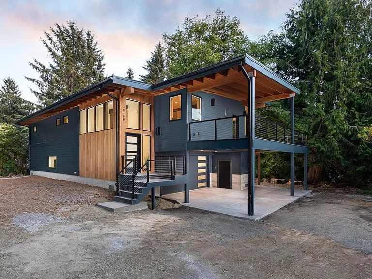 a house with a staircase in front of it at Whispering Waters Retreat in Pacific City