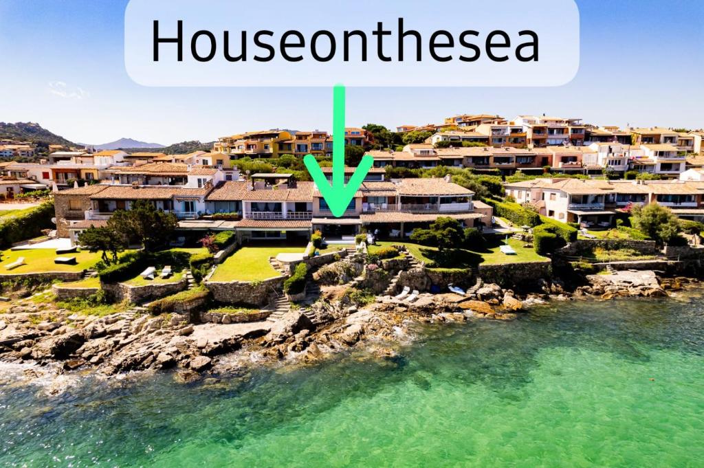 an aerial view of a house in the water at House On The Sea Porto Rotondo in Porto Rotondo