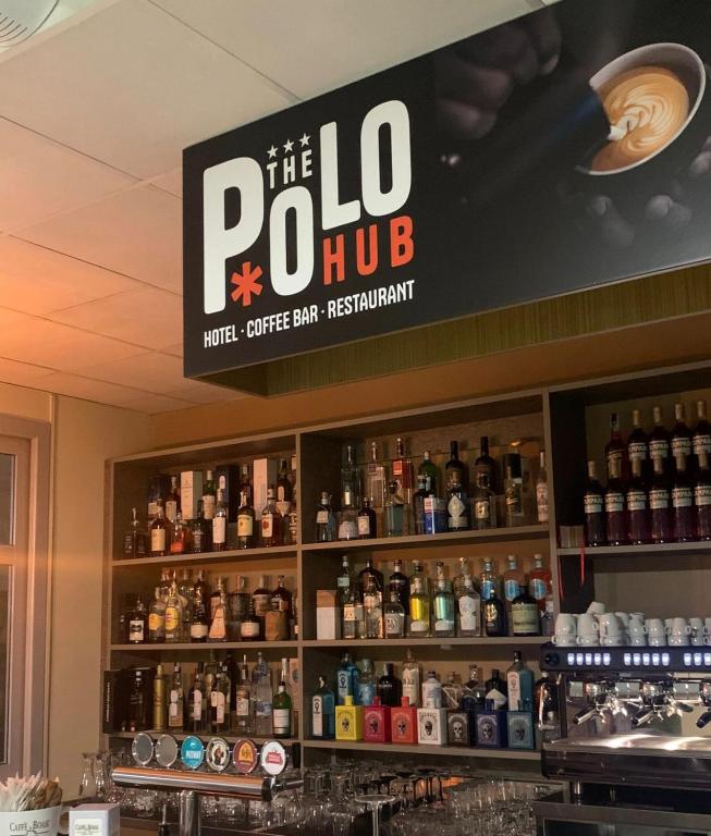 a sign above the bar of a bottle shop at The Polo Hub in Mortara