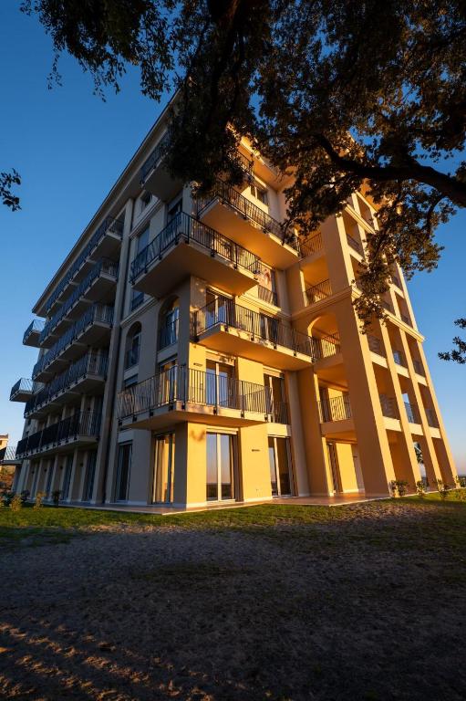 a large building with balconies on the side of it at VillaPignone in Genoa