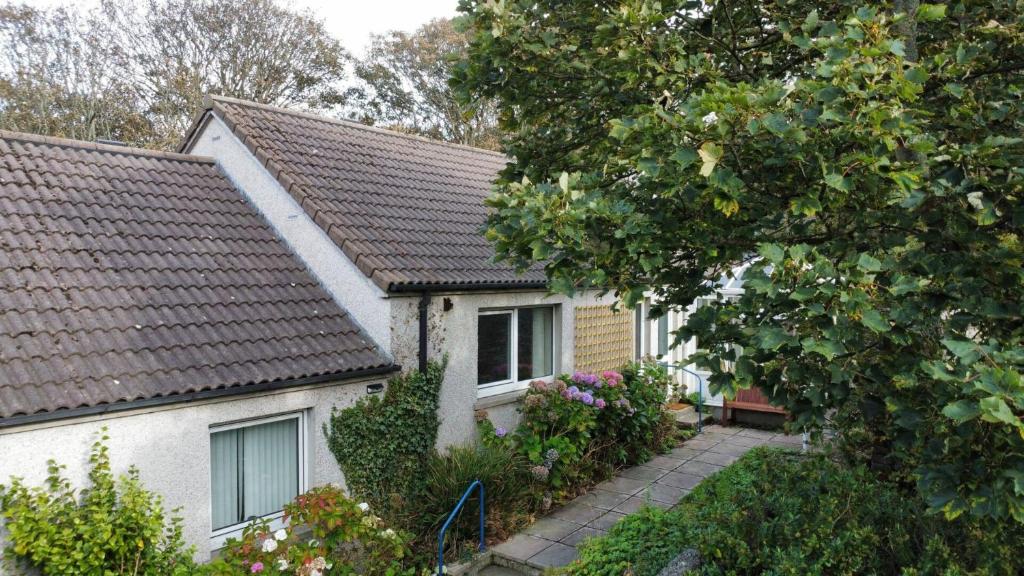 a white house with a brown roof at 54a Albert Street, Kirkwall, Orkney - OR00603F in Kirkwall