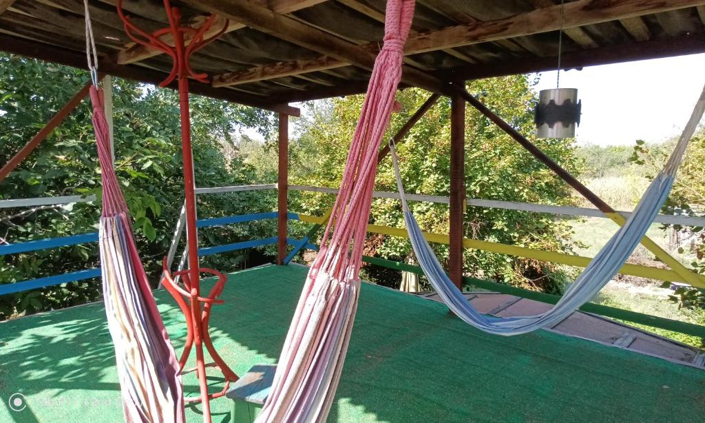 a porch with hammocks hanging from a roof at Граничар 3 СЪРФА - морската каюта in Granichar