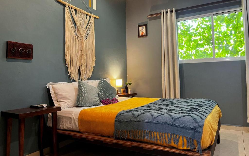 a bed in a room with a window and a bed sidx sidx sidx at Departamento Luna in Valladolid