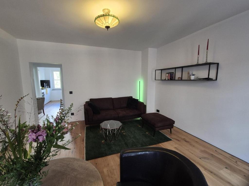 a living room with a couch and a table at FeWo Altstadt in Stralsund