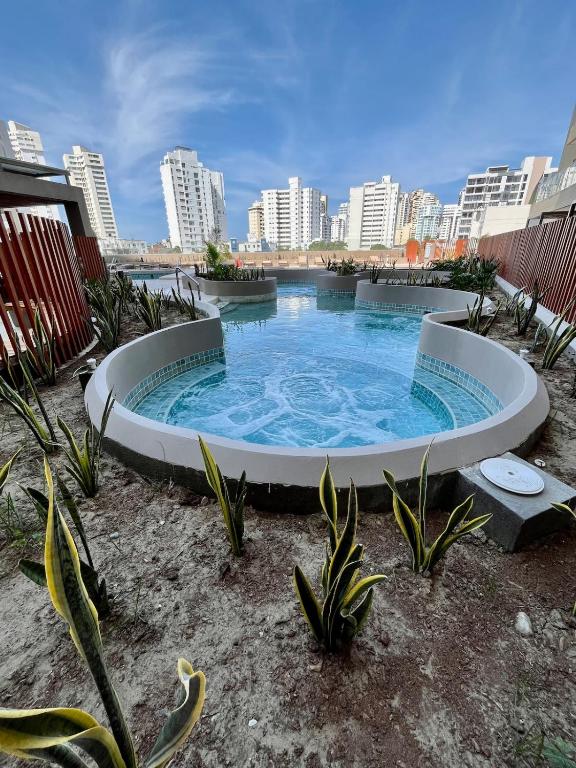 a large circular pool in the middle of a city at Ola del Mar in Gaira