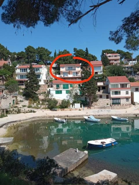 an orange circle in the middle of a body of water at Apartmani Antonio Basina in Vrbanj