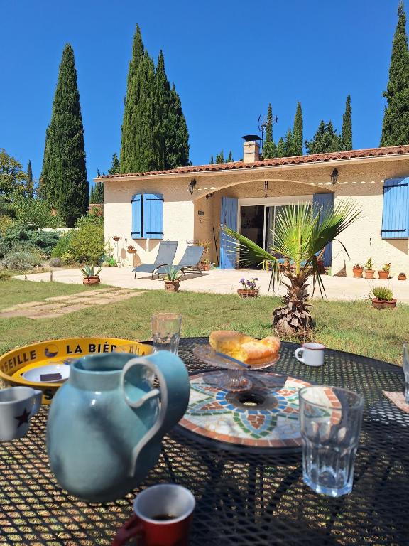 a table with a plate of food on top of it at Vintage Provence in Arles