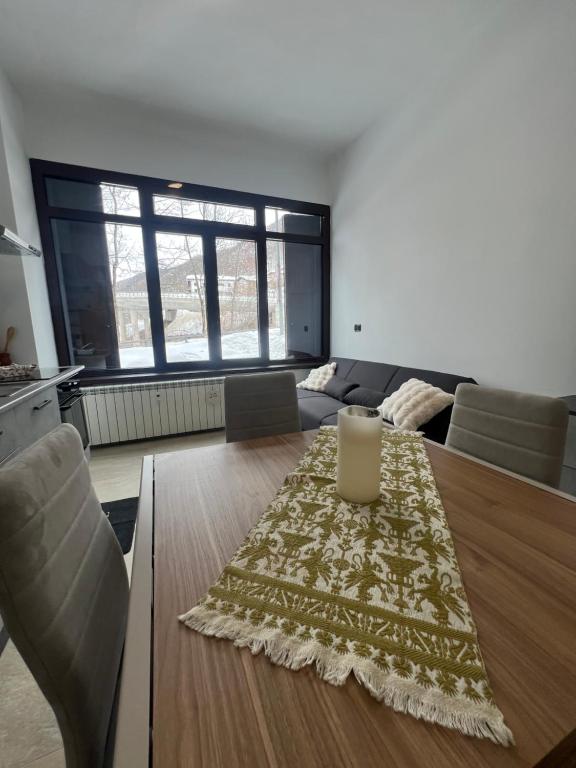 a living room with a table and a couch at Lemon Suite - Titty's Studio - Limone Piemonte in Limone Piemonte