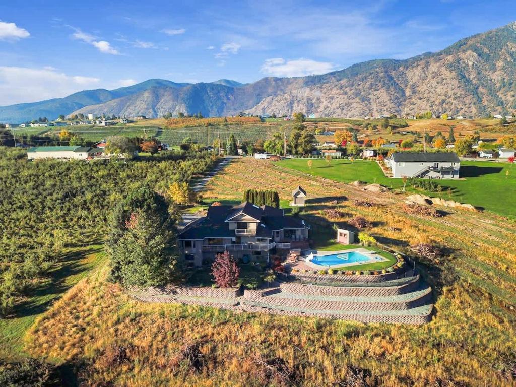 an aerial view of a house on a hill at Three Lakes Haven - Pacific Retreats in Manson