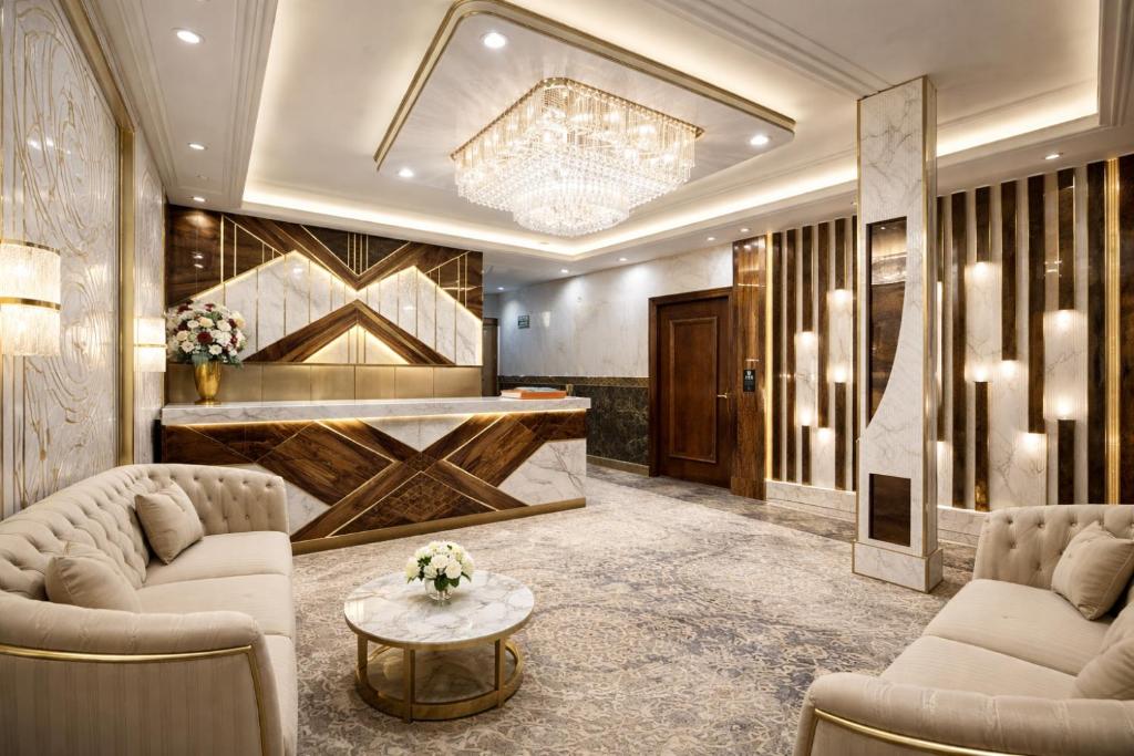 a lobby with two couches and a table at Hotel New Frontier, City Centre - Walk in Chandni Chowk & OLD Delhi Station in New Delhi