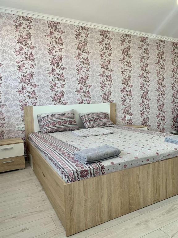 Llit o llits en una habitació de Sun Apartment Center