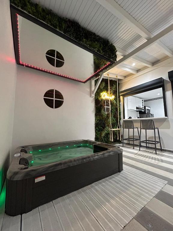 a pool table in the middle of a room at Obonheur avec Jacuzzi in Le Gosier