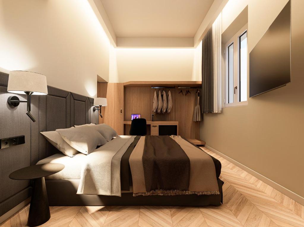 a bedroom with a large bed and a desk at Essence 55 Living in Rhodes Town