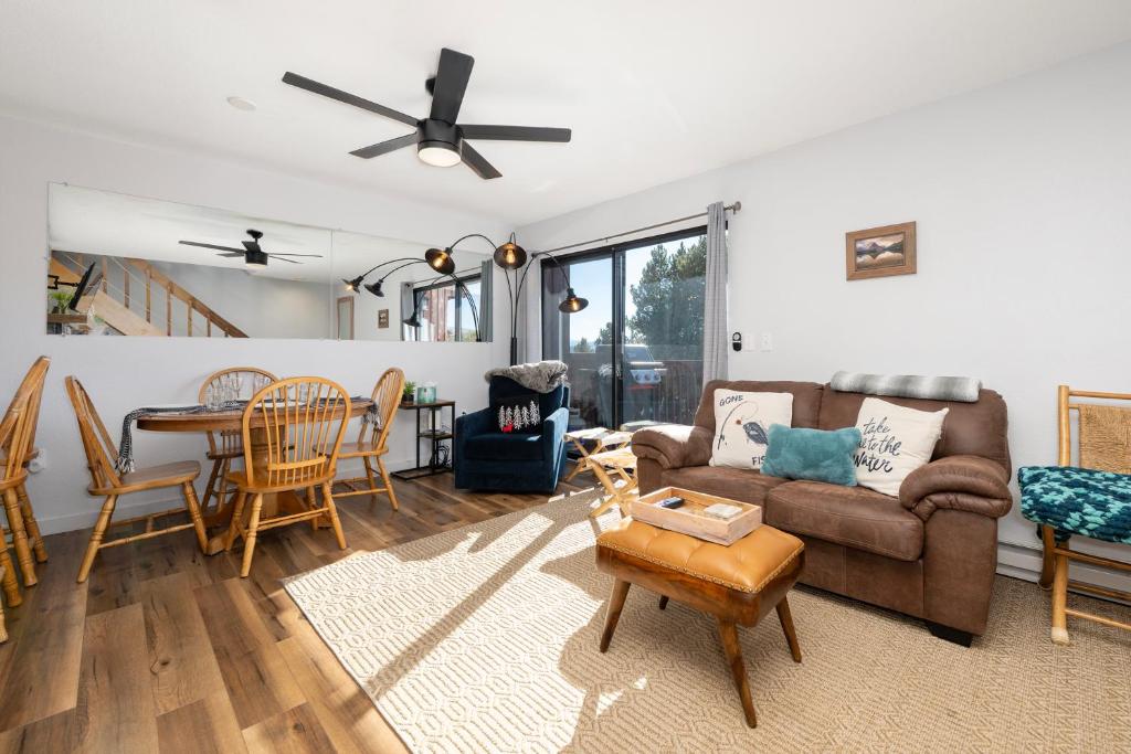 a living room with a couch and a table at Soda Springs Ranch Unit 3C in Grand Lake